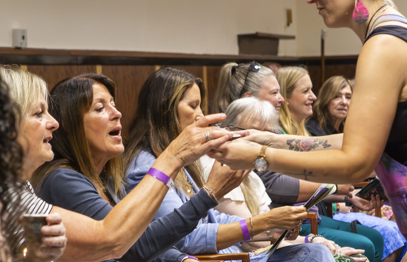 Cacao being handed to seated guests during the opening ceremony